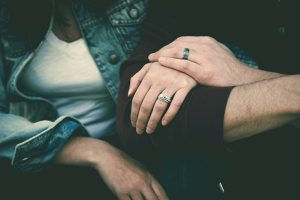 couple with rings on, linking arms. dealing with affairs. ian robertson. couple therapy in niagara ontario
