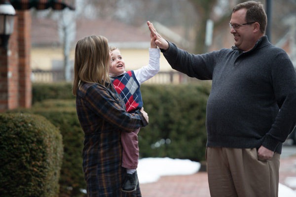 mom and child high five a man. how to integrate the blended family. niagara based therapist, ian robertson explains how to bond a blended family