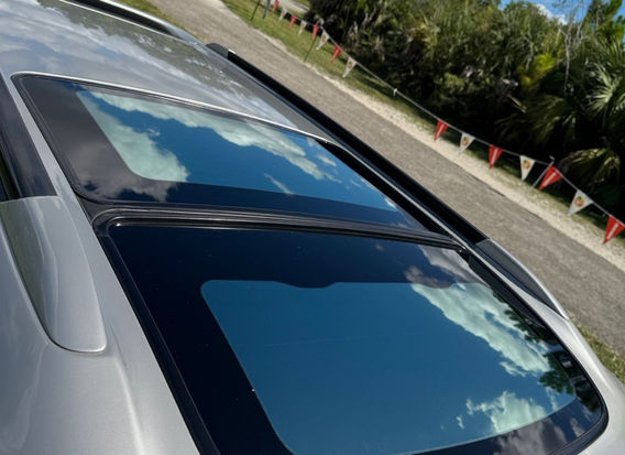 Roof and sunroof of 2000 Subaru Legacy GT-B E-Tune — factory original paint and finish.