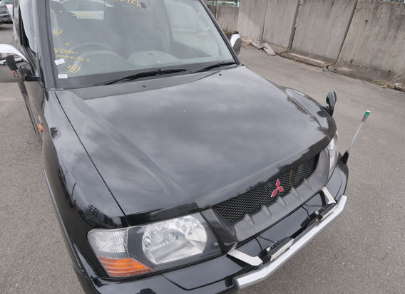1999 Mitsubishi Pajero 4WD turbo diesel SUV in original black with 79k miles front exterior view Japanese import for sale