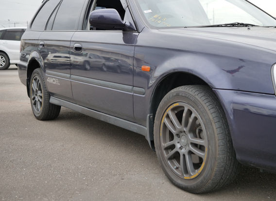 Side profile of 1996 Honda Orthia 2.0GX 4WD in original navy with alloy wheels and clean body lines.