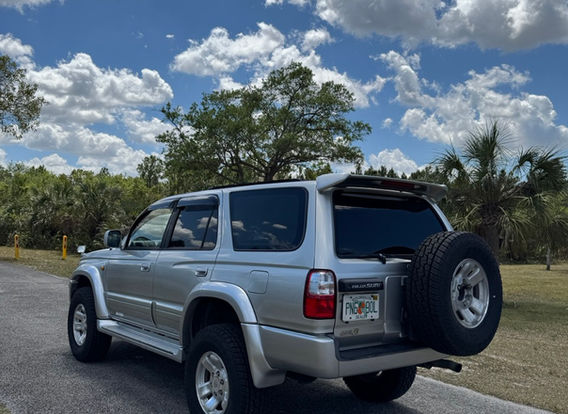 Side profile of the lifted Toyota Hilux Surf SSR-X 4WD, featuring a 3-inch total lift with oversized tires and new shock absorbers.