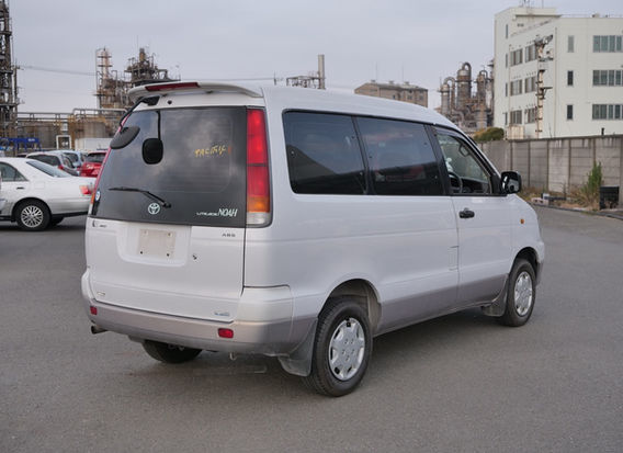 1998 Toyota LiteAce Noah 4WD rear view with tail lights, rear hatch, tall roofline, and tinted glass
