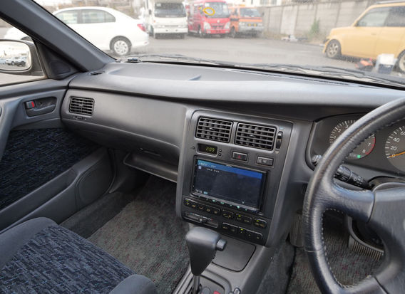 Interior of 1994 Toyota Caldina TZ 4WD with clean cloth seats, original dashboard, and intact factory features.