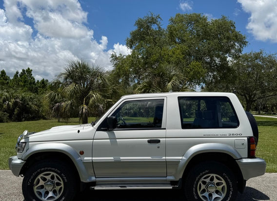 1996 Mitsubishi Pajero Wide XR1 in white for sale at Lion JDM Imports LLC – classic Japanese SUV with nationwide shipping available.