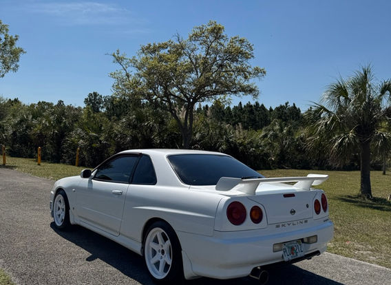 Side profile of the R34 GTT sitting on 17x9 ET30 TE37-style white wheels wrapped in Michelin Pilot Sport 4S tires.