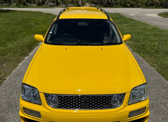Front view of 1998 Nissan Stagea RS Four V in rare factory yellow – turbocharged RB25DET Neo engine, JDM AWD wagon imported to the USA