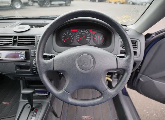 Interior of 1996 Honda Orthia 2.0GX 4WD with clean cloth seats, original dashboard, and power features.