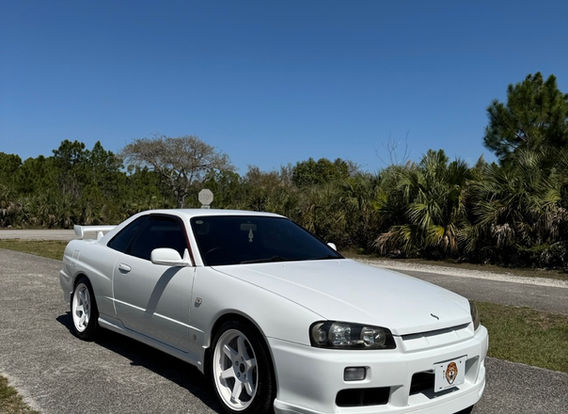 Side profile of the R34 GTT sitting on 17x9 ET30 TE37-style white wheels wrapped in Michelin Pilot Sport 4S tires.