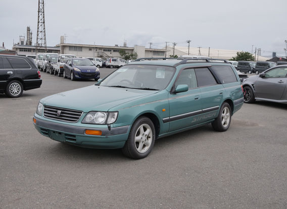 1997 Nissan Stagea 25X wagon in original green with 10k miles showing front exterior, factory alloy wheels, automatic transmission and exceptionally preserved condition