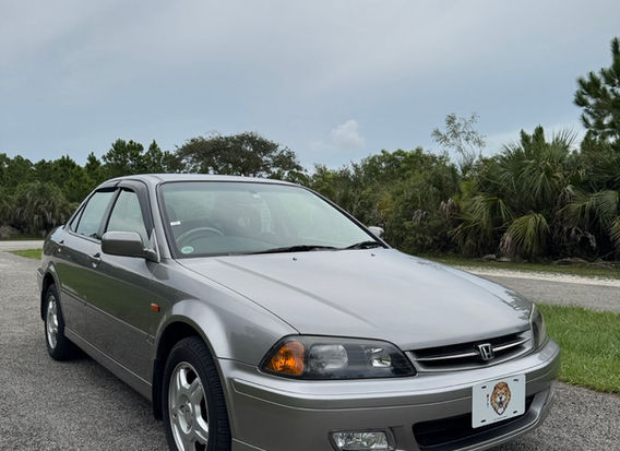 Right-hand drive 2000 Honda Torneo 2.0 VTS 4WD for sale by JDM Importer Lion JDM Imports LLC – front view of a silver sedan with a sleek, modern design, showcasing its AWD capabilities, sporty wheels, and well-maintained exterior, perfect for JDM Imports enthusiasts.