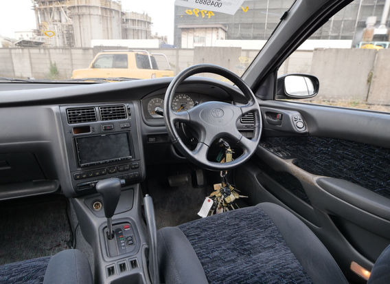 Interior of 1994 Toyota Caldina TZ 4WD with clean cloth seats, original dashboard, and intact factory features.