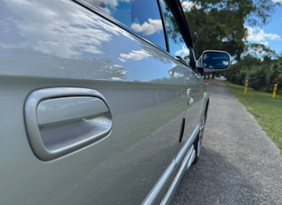 Side profile of 2000 Subaru Legacy GT-B E-Tune wagon — one-owner twin-turbo AWD with Bilstein sport suspension.