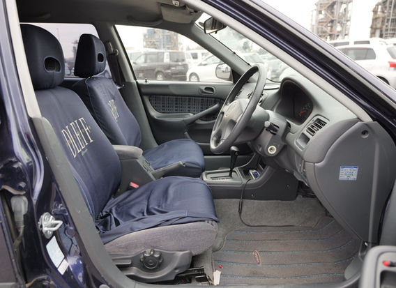 Interior of 1996 Honda Orthia 2.0GX 4WD with clean cloth seats, original dashboard, and power features.