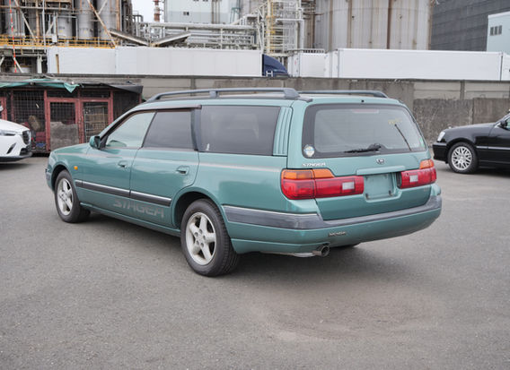Rear view of 1997 Nissan Stagea 25X JDM wagon original green paint low mileage 10k miles