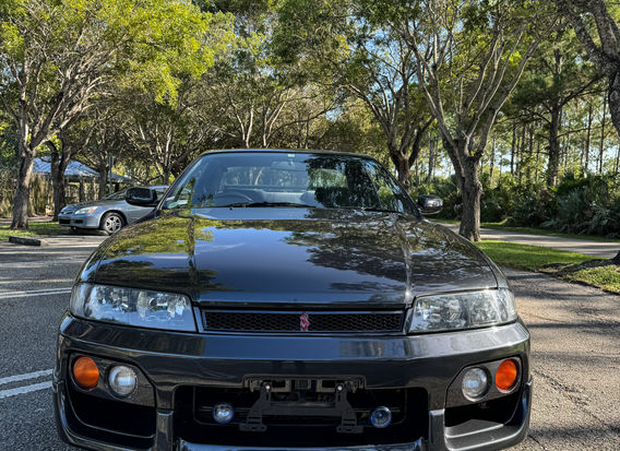 1997 Nissan Skyline R33 GTS25T Type M for Sale – A legendary JDM sports car powered by a turbocharged RB25DET engine, offering rear-wheel drive performance and iconic styling. The Type M trim features enhanced handling and sporty design elements, making it a sought-after choice for enthusiasts. Well-maintained and ready to impress.