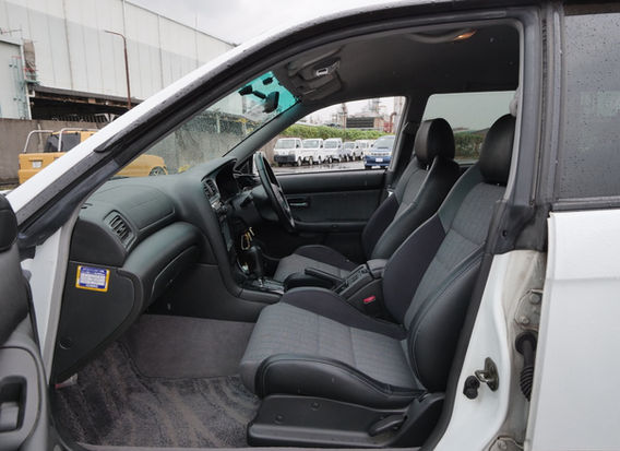 Interior of 1999 Subaru Legacy Wagon GT-B E-Tune – half-leather sport seats, driver-focused cockpit, and well-preserved cabin