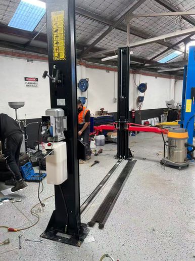 Two-post vehicle hoist installed in a Sydney Bankstown workshop