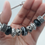 Thumbnail: Black Metal Lined Charm Bangle Bracelet