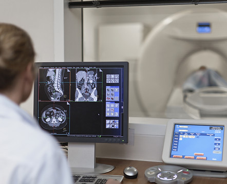 Doctor Operating CT Scanner