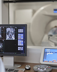 Doctor Operating CT Scanner