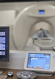 Doctor Operating CT Scanner