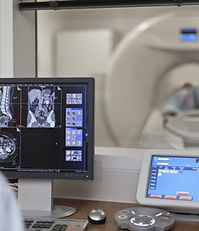 Doctor Operating CT Scanner