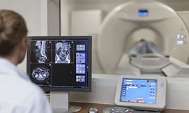 Doctor Operating CT Scanner