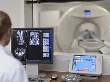 Doctor Operating CT Scanner