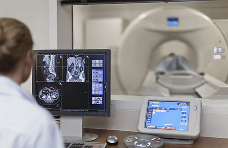 Doctor Operating CT Scanner