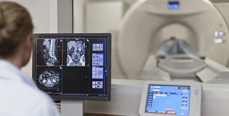 Doctor Operating CT Scanner