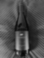 B&W photo of Huxbear Laid Bare Chardonnay 2023
