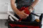 A plumber preparing tools for maintenance