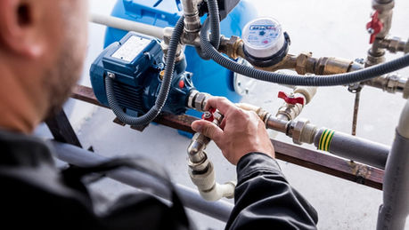 Technician fixing a water utility