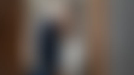 Plumber inspecting a toilet tank