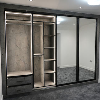Large fitted wardrobe in bedroom