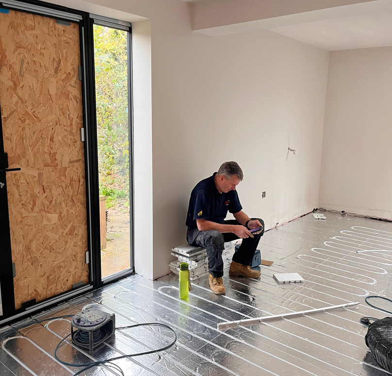 Man laying underfloor heating