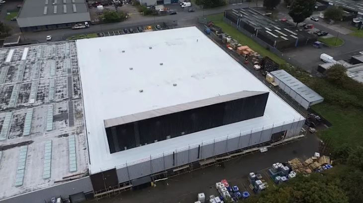Industrial scale roofing project front aerial view