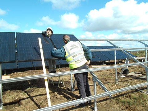 Worker fitting solar panels