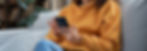 Happy millennial hispanic teen girl checking social media holding smartphone at home. Smil