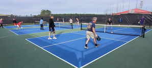 Pickleball players enjoying a sunny outdoor game