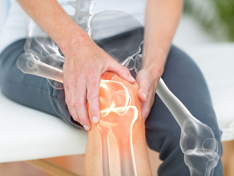 Man holding his knee in pain