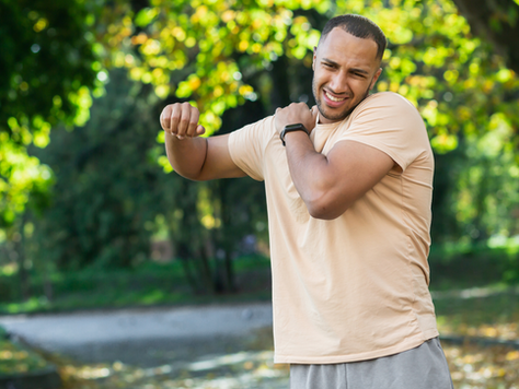 Man holding shoulder in pain
