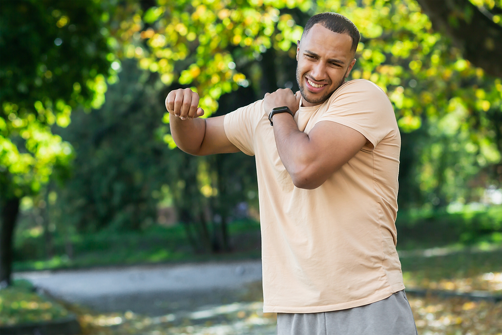 Man holding shoulder in pain