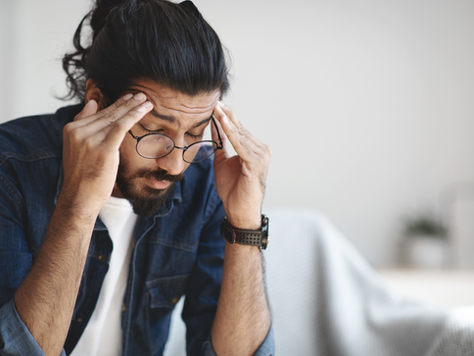 Man massaging head due to pain