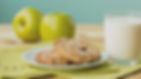 green apples glass of milk and grain bread