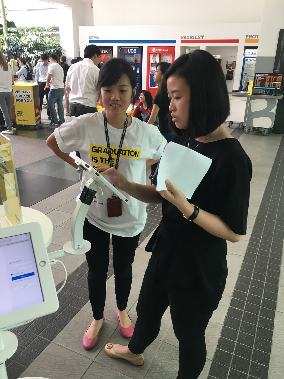 A student using an onsite iPad to find out more about what Bloomberg has to offer.
