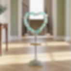 Thumbnail: A stunning piece of coastal-inspired interior decor: a heart sculpture meticulously crafted from sea glass and stones