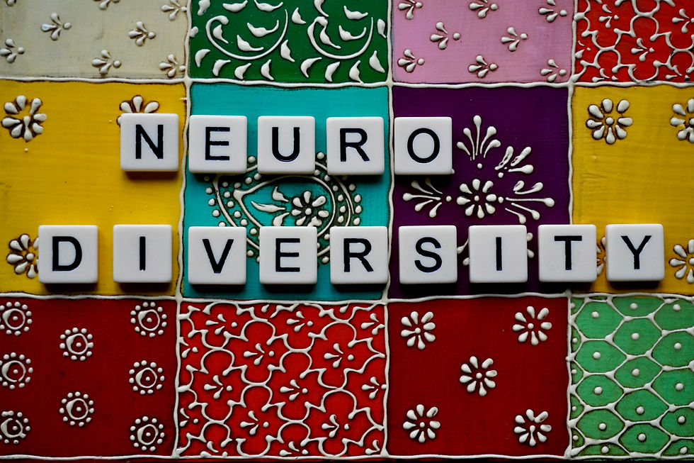 Colorful quilt pattern with the word “neurodiversity” representing inclusion and different ways of learning.