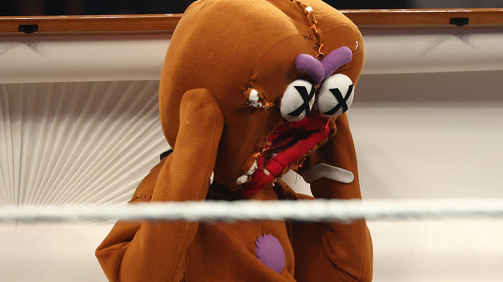 The Gingerbread Man has arisen from the dead as he attacked Sami Zayn, as Trick Williams and the Gingerbread Man are back together, working in full force. (Image courtesy of WWE)